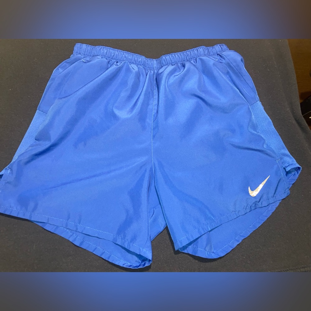 Blue Nike running shorts.
